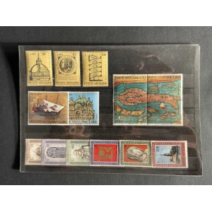 BM_1212_f-1.jpg A collection of Vatican stamps displayed on a black page, featuring domed building, coin portrait, staircase design, a large map-like seal, and boat and cathedral images.