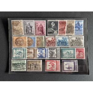 Row of vintage Vatican postage stamps arranged in an album page with varied colors and denominations.