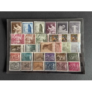 BM_1218_f-1.jpg Sheet of Vatican postage stamps in a plastic album page, showing a colorful mix of portraits, monuments, and religious scenes.