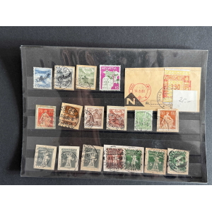 Stamp album page with a row of Swiss Helvetia stamps in blue, brown, green, purple, and orange, mostly canceled on a black binder page.