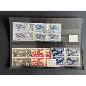 Block of six blue 2 Fr Pro Aero aircraft stamps from Helvetia on a black album page.