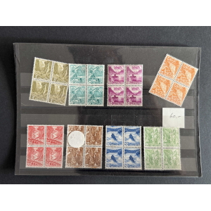 Sheet of vintage Swiss postage stamps in a clear album page, organized by color and value (3–35 Helvetia). Patterned blocks with brown, blue, green, red stamps; some blocks form pairs or strips; a white circular center stamp is visible.