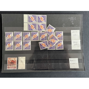 Album page displaying Liechtenstein stamps: a grid of purple stamps with orange numbers (5, 10, 15, 20, 25, 30, 40, 50) and a few scattered stamps, plus one red 20 stamp in the bottom-left corner and small handwritten notes on the right and bottom rows.