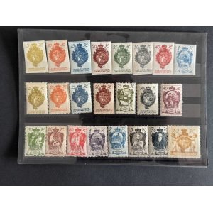 Sheet of vintage Liechtenstein stamps arranged in three rows, each with ornate crest and denomination numerals in different colors (5–80).