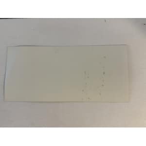 Blank white postcard on a light surface with a few brownish spots along the right edge.