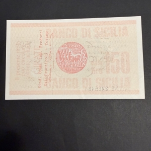 Pink postage stamp on dark background, with a central circular emblem showing a chariot and horses and Italian text around it.